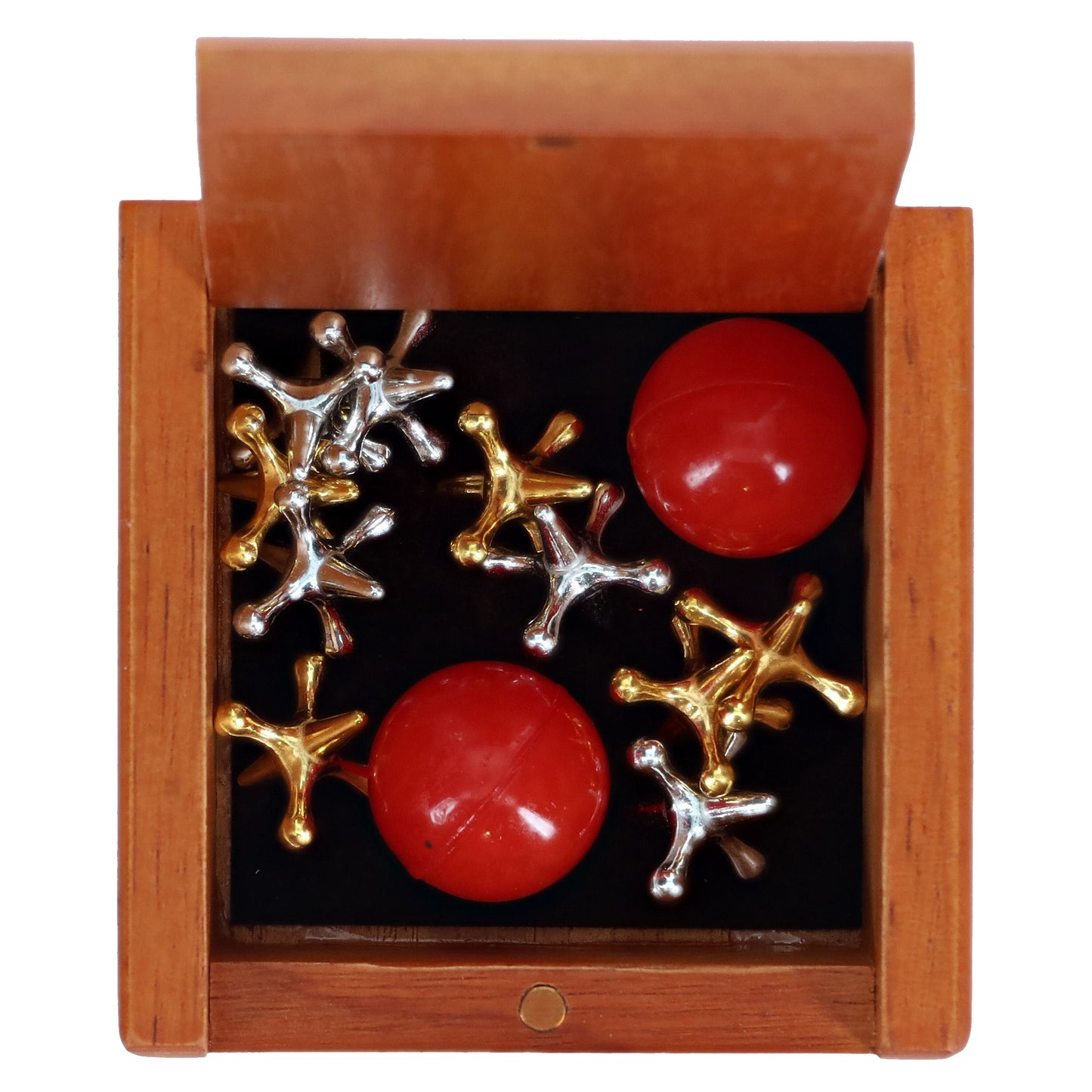 Old-Fashioned Metal Jacks in a Wooden Box