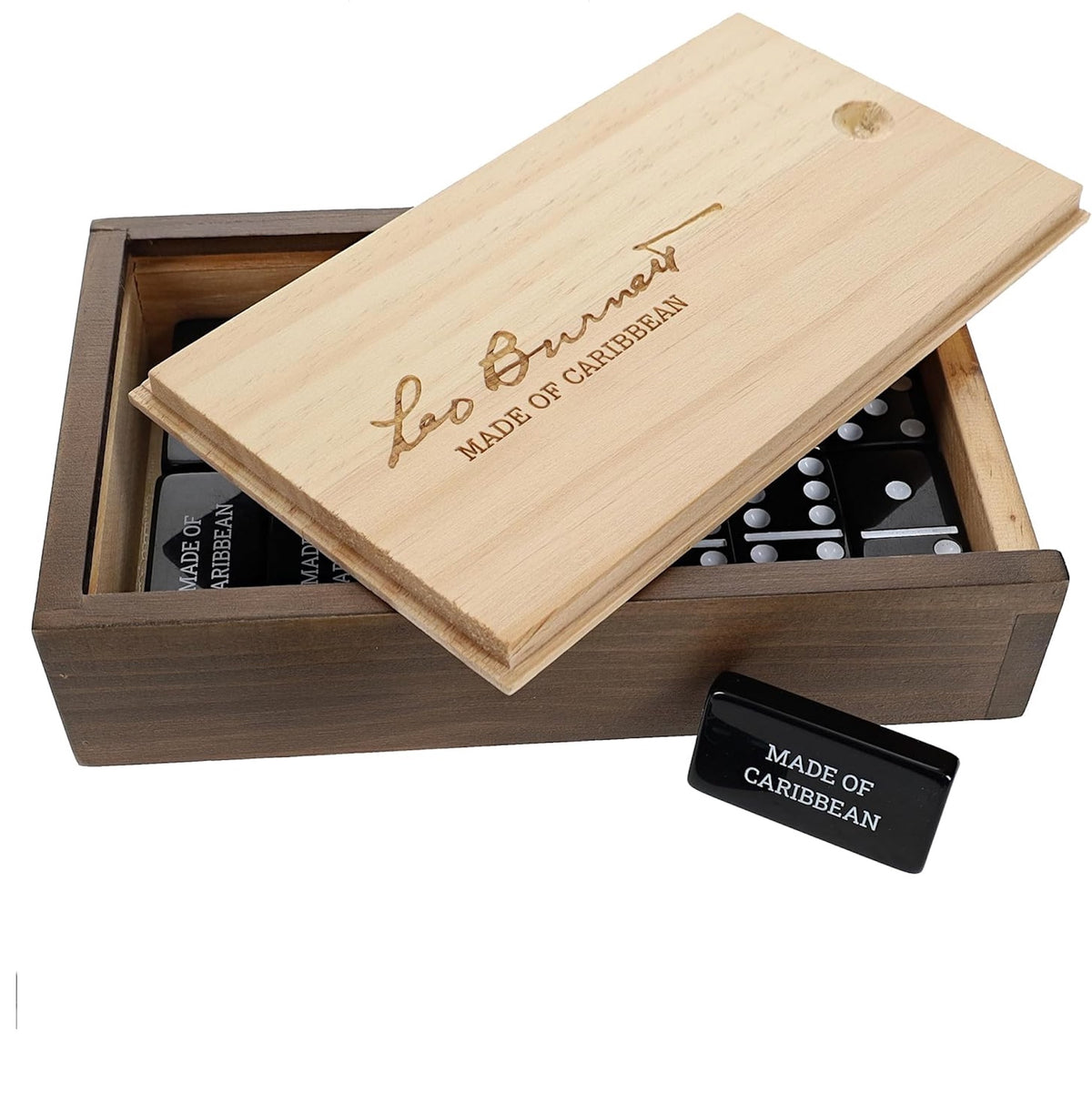 A wooden gift box set with a light natural wood lid engraved 'Leo Burnett MADE OF CARIBBEAN' and a darker brown wooden box containing black and white dominoes, with a small black plaque reading 'MADE OF CARIBBEAN' on a white background.