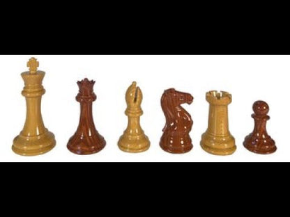 Man showing the camera each wood grain spruce tek chess pieces. On wood board.