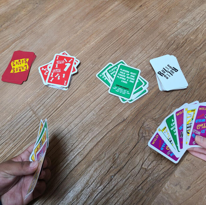 chaos card game in player's hands